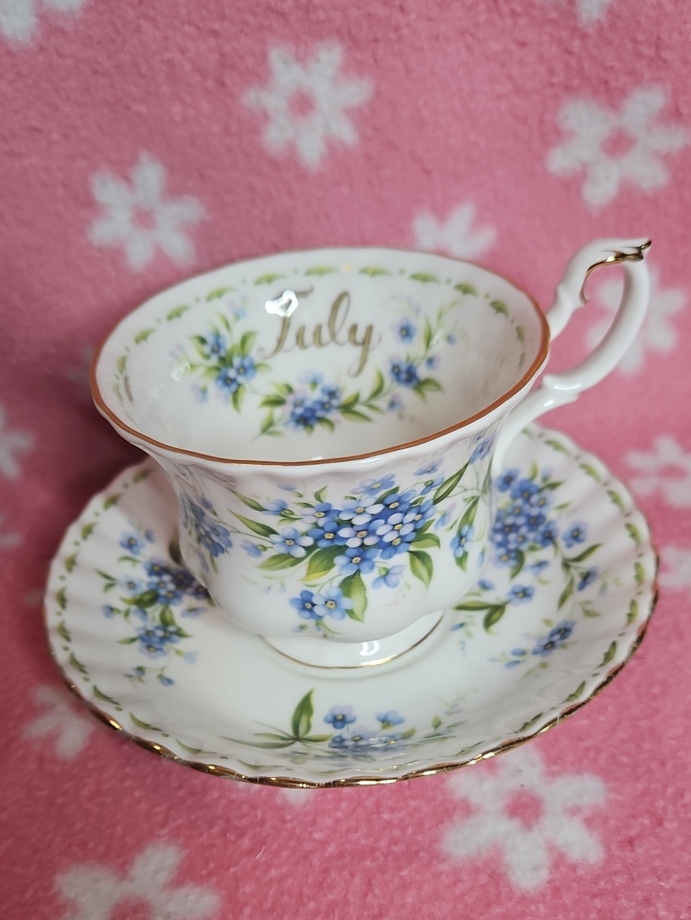 July 1970 Floral Bone China Teacup and Saucer - Gold Trim, Blue Floral